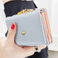 Portefeuille femme compact avec fermoir rétro et petit cœur doré