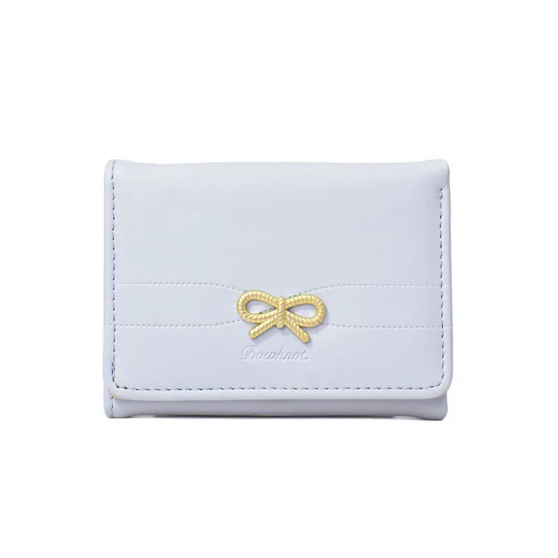Portefeuille compact à nœud doré et triple volet pour fille — photo 10