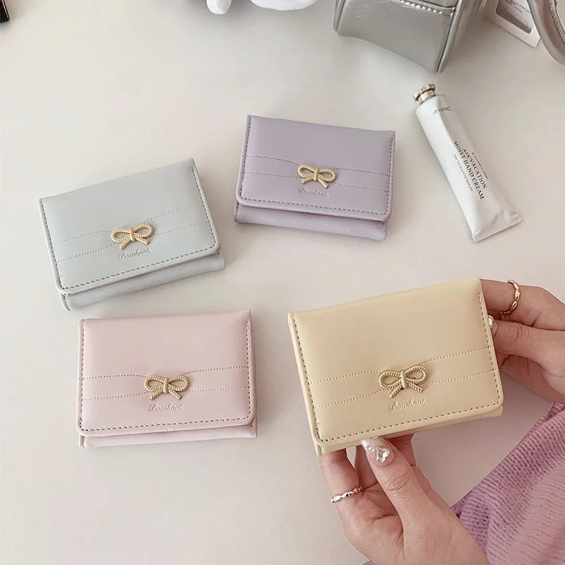 Portefeuille compact à nœud doré et triple volet pour fille — photo 2