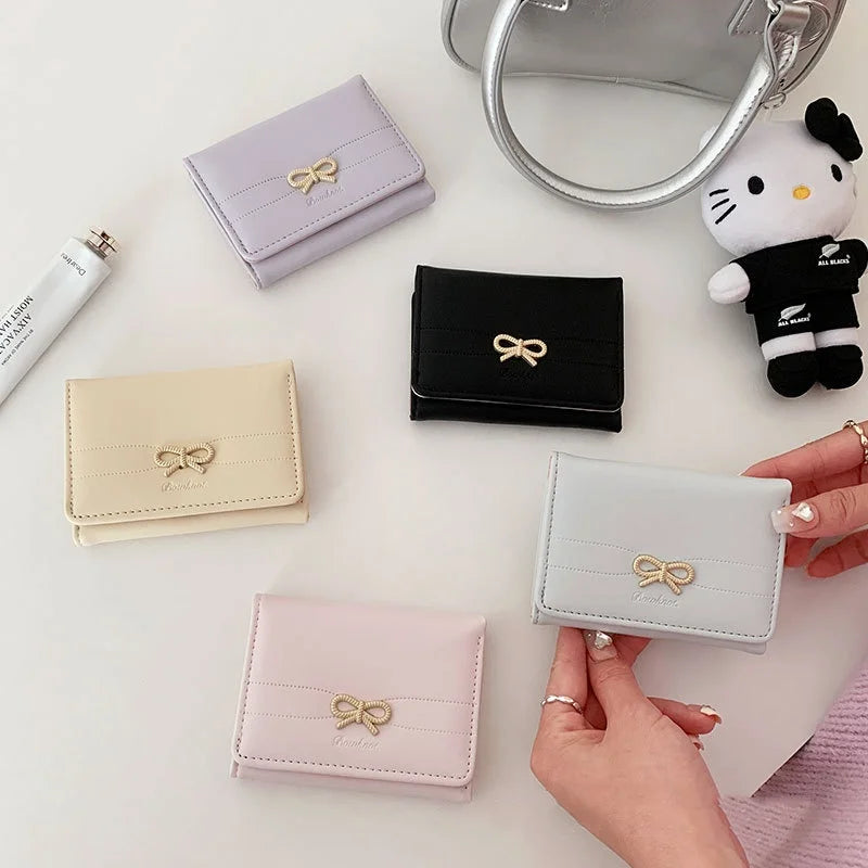 Portefeuille compact à nœud doré et triple volet pour fille — photo 5