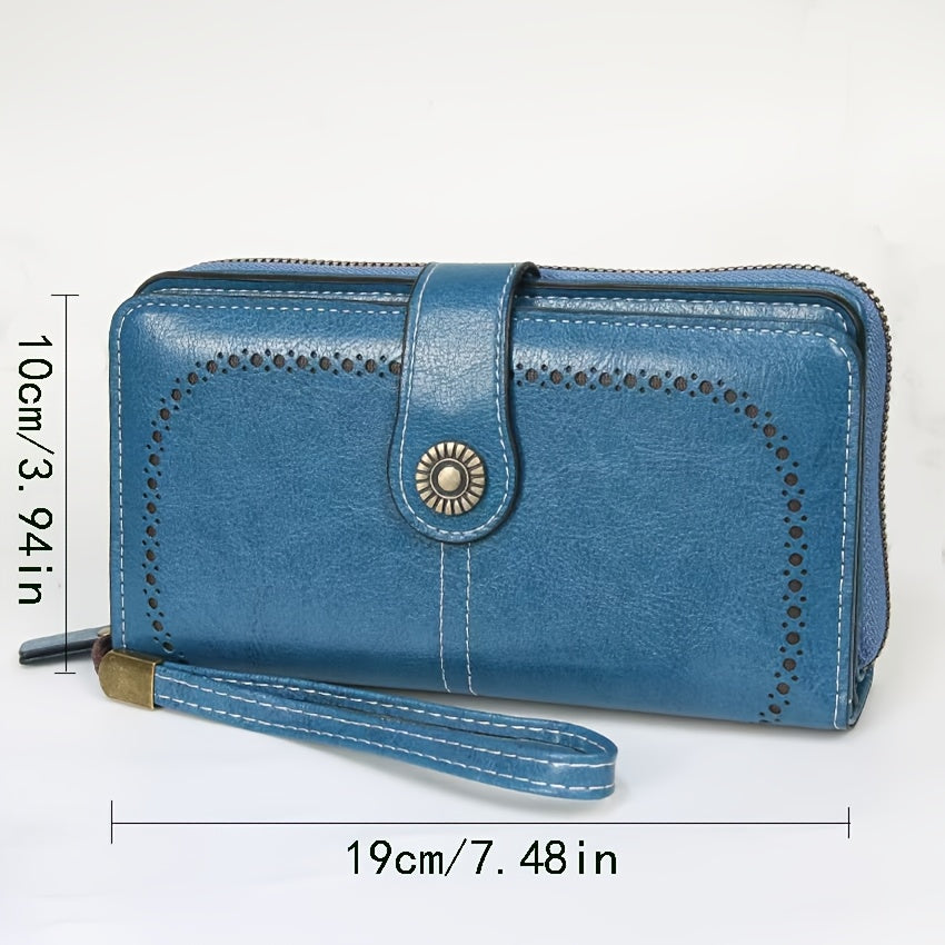 Portefeuille femme long bleu, perforations ajourées et zip