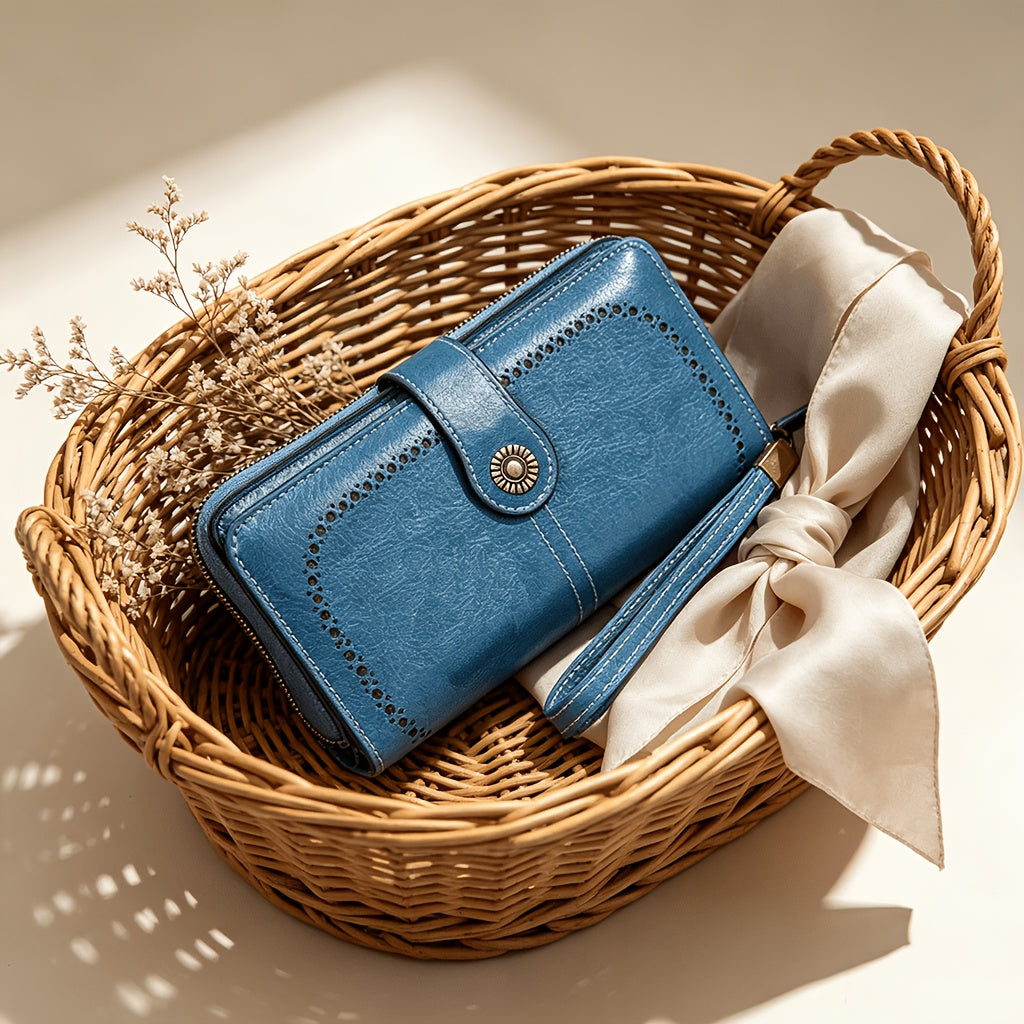 Portefeuille femme long bleu, perforations ajourées et zip