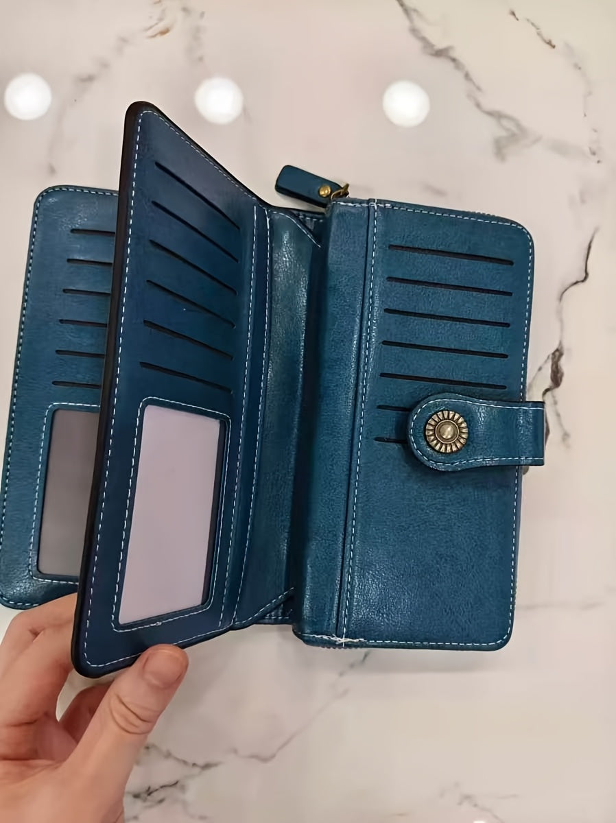 Portefeuille femme long bleu, perforations ajourées et zip