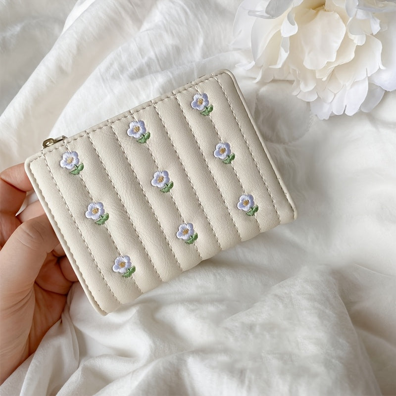 Portefeuille femme à marguerites brodées, format deux volets