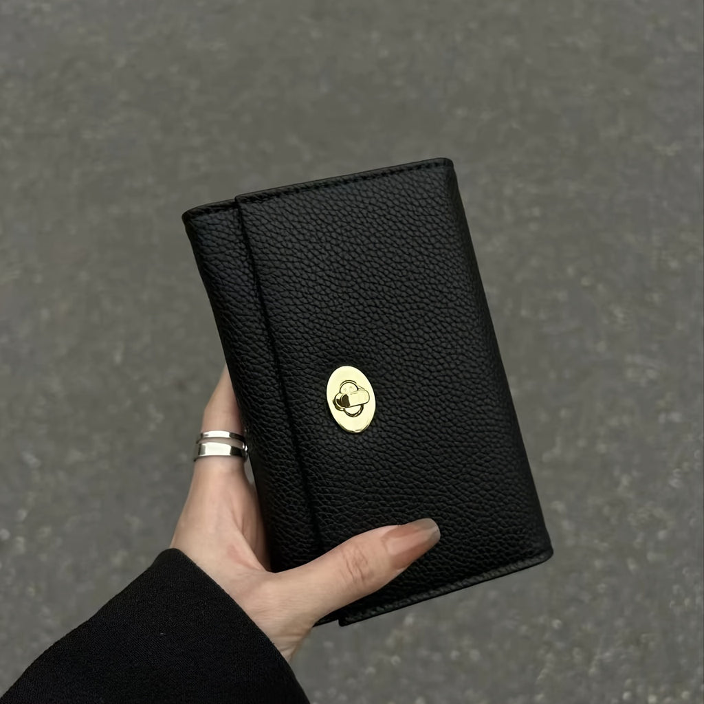 Portefeuille femme noir compact à tourniquet métallique doré