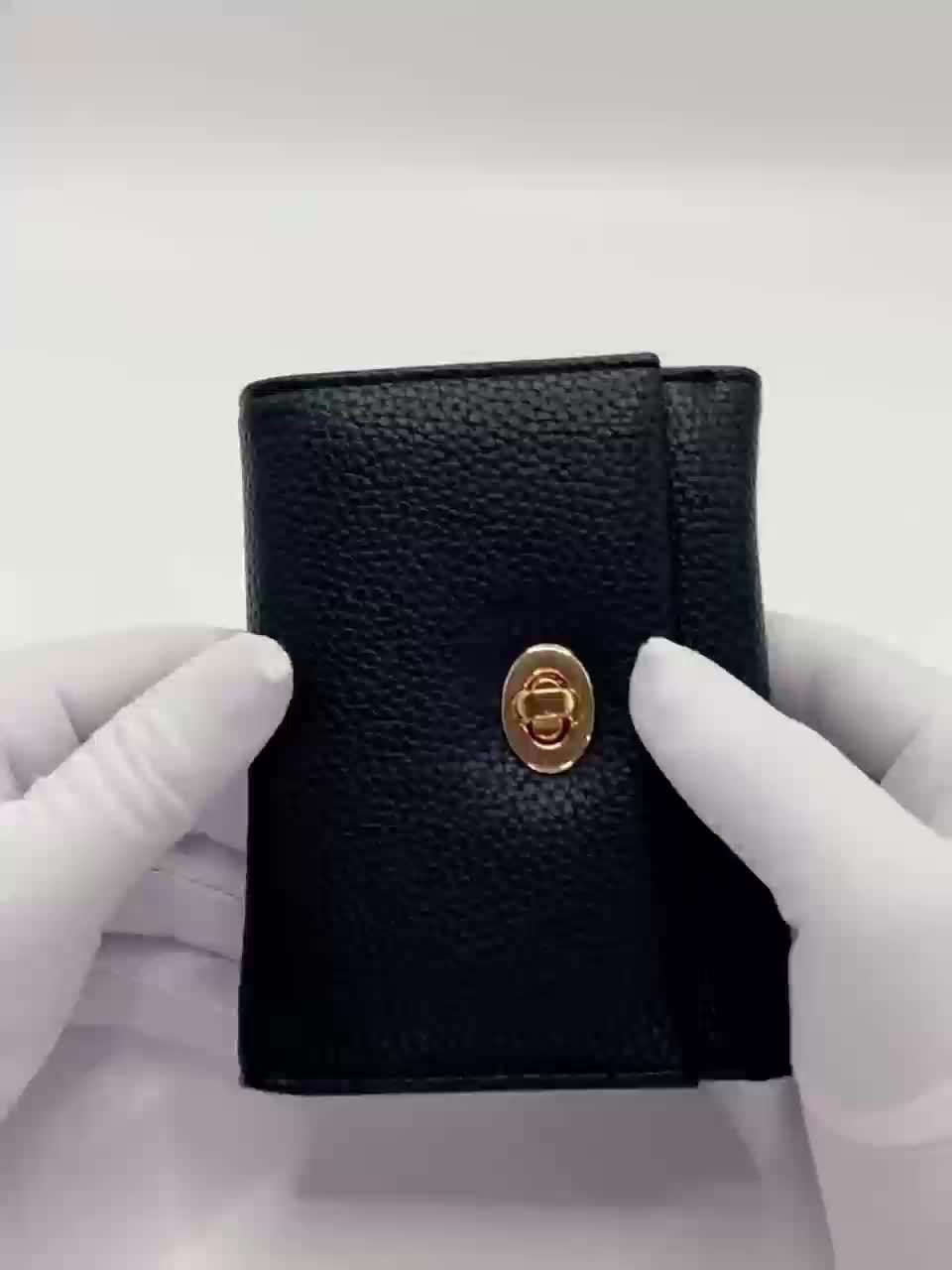 Portefeuille femme noir compact à tourniquet métallique doré