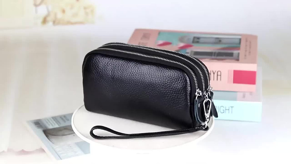 Portefeuille femme pochette à trois compartiments zippés